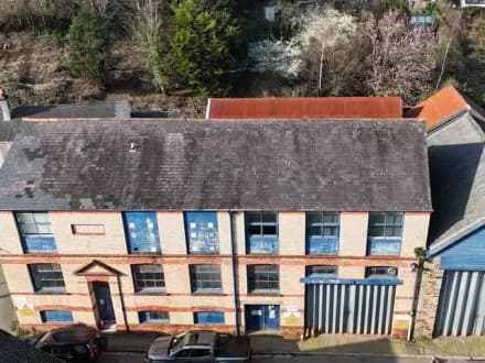 LARGE COMMERCIAL BUILDING, DETACHED HOUSE, WORKSHOP & LAND