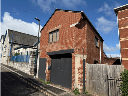 FORMER GARAGE AND STORAGE BUILDING FOR DEVELOPMENT