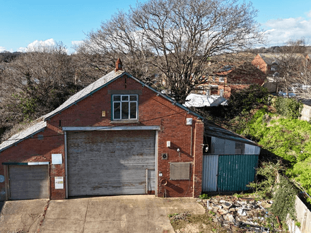 FORMER GARAGE ON LARGE PLOT WITH POTENTIAL